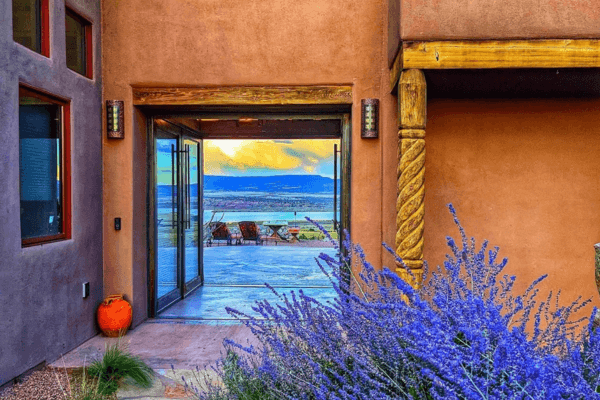 Scenic view of water and mountains through an exterior doorway